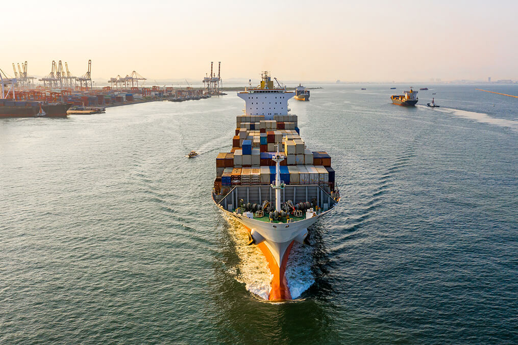 Cargo shipping container leaving port