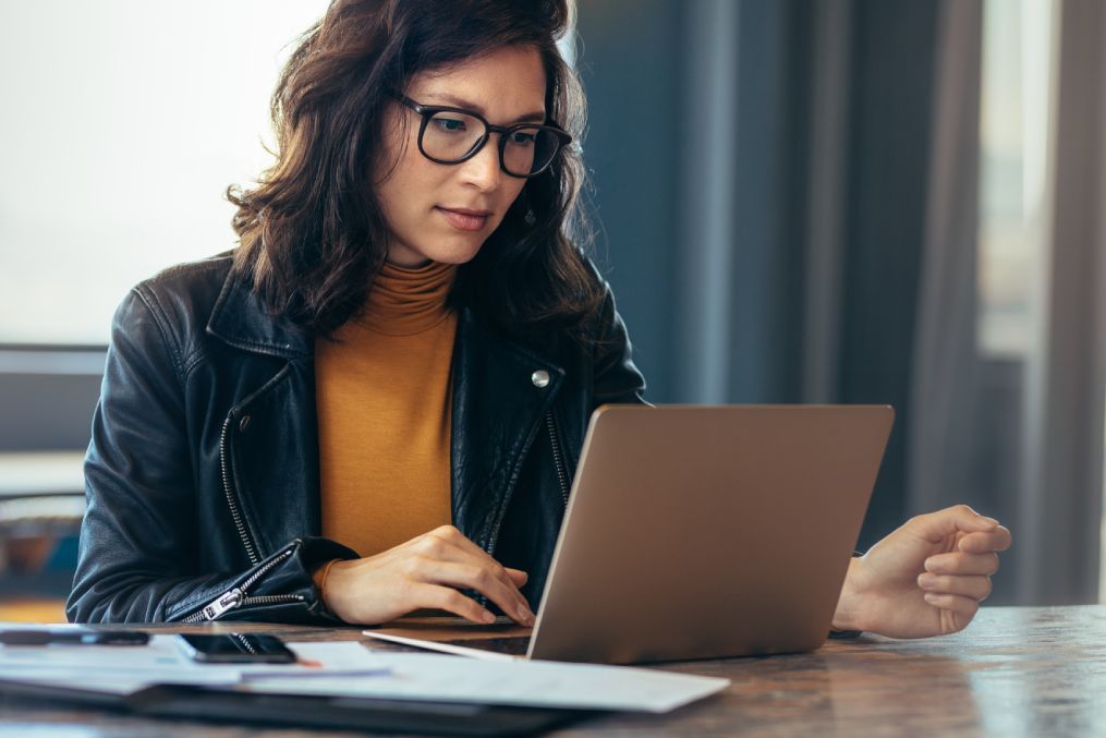 Asian woman working laptop. Business woman busy working on laptop computer at office.