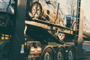 Car Transporter parked on road side vintage filter effect