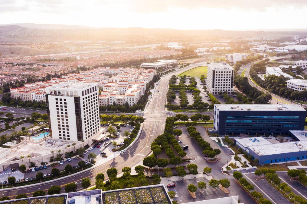 Aerial sunset view of the skyline of downtown Irvine, California, USA.