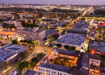 Evening traffic streams down Harbor Blvd in the downtown district of Fullerton.