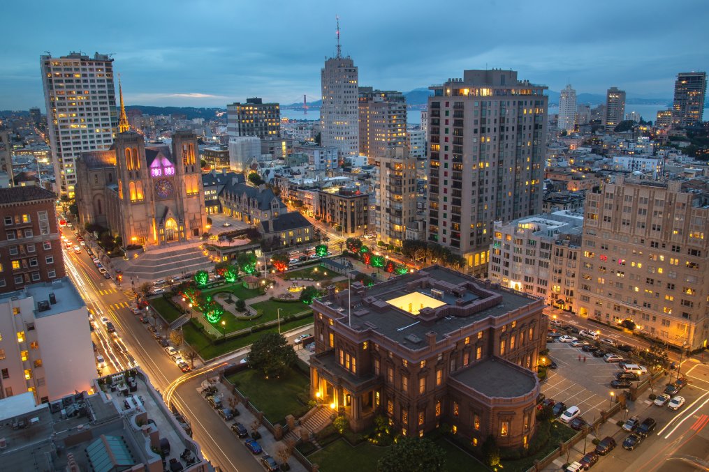 Huntington Park and Grace Cathedral in San Francisco aerial view at evening dusk time with illumination