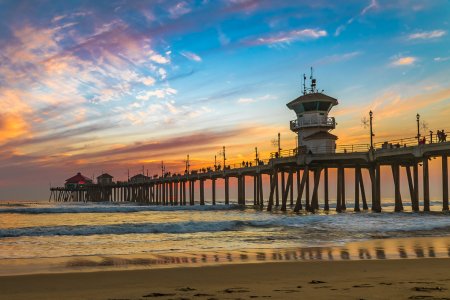 Incredible colors of sunset by Huntington Beach Pier, in the famous surf city in California