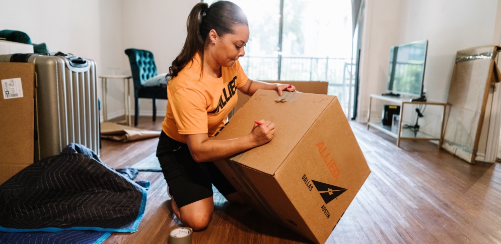 Woman handling box.
