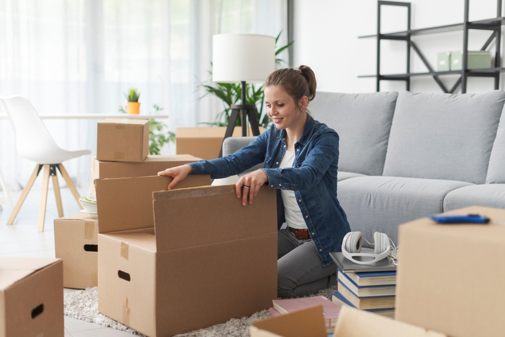 Young happy woman doing a home relocation.