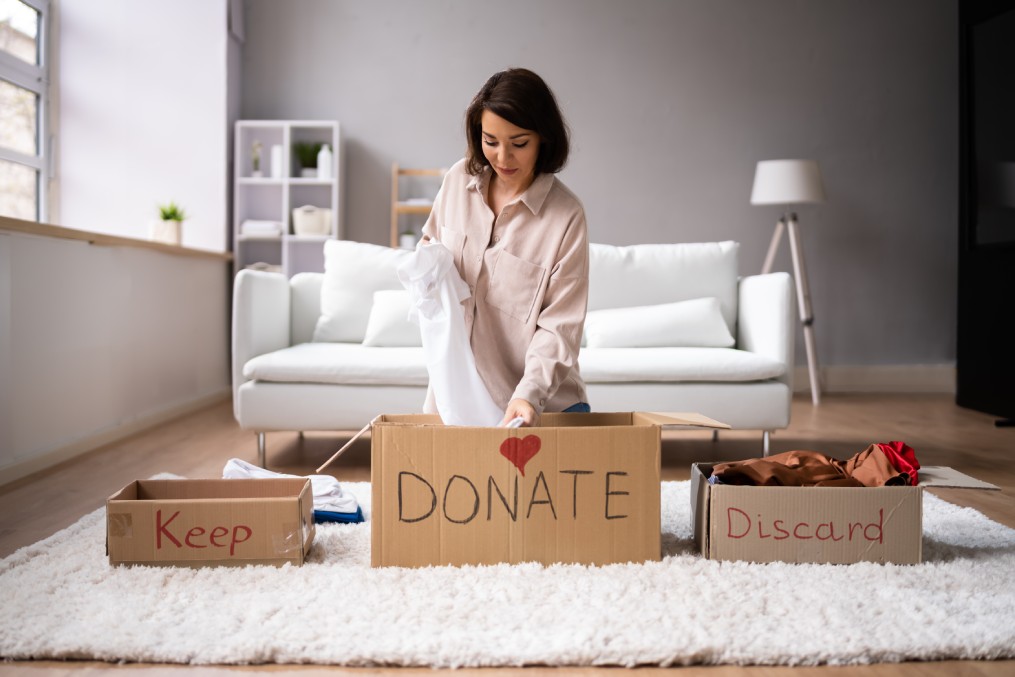 Woman packing and decluttering.