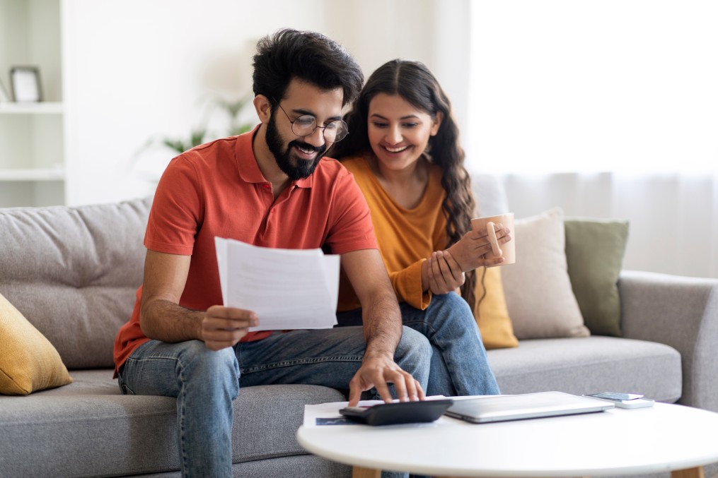 Couple making moving checklist.