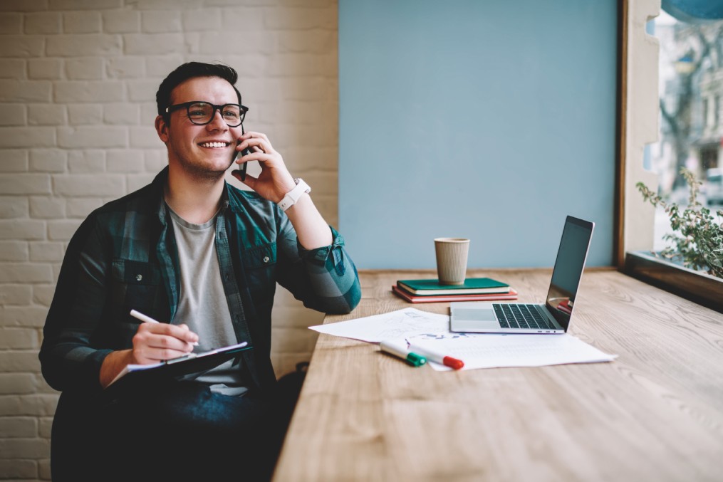 Man calling companies to update address information.