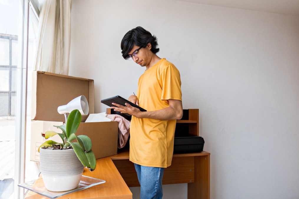 young man unpacking