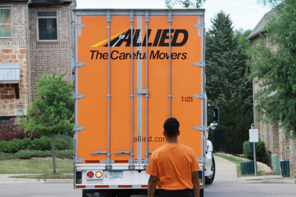 Atlas Allied truck moving company. Worker and trailer