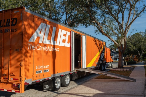 An orange moving truck featuring the name "Allied" part of Chula Vista Movers' fleet.