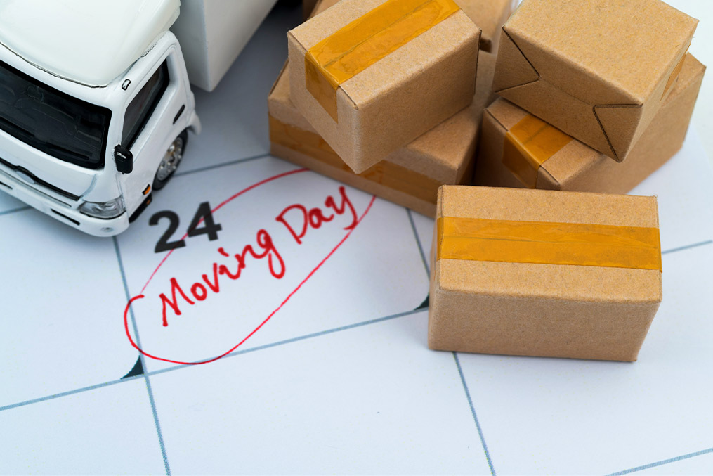 A vibrant moving day image showing boxes and furniture being packed for a San Diego to Boston relocation adventure.