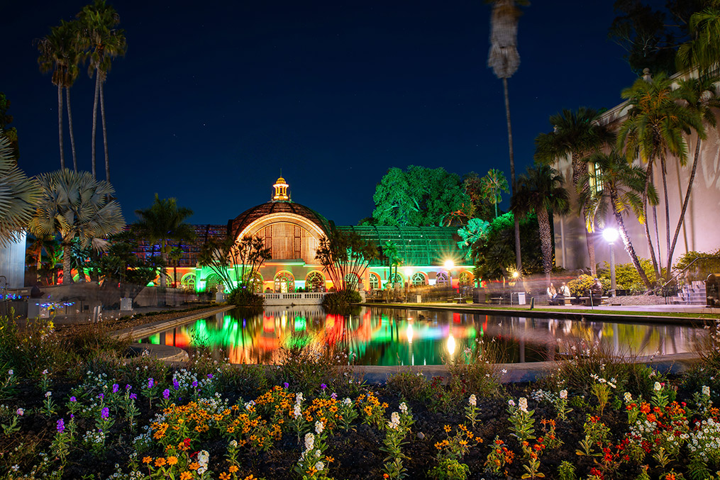 A brightly lit fountain in Balboa Park at night, showcasing a serene winter atmosphere in San Diego.