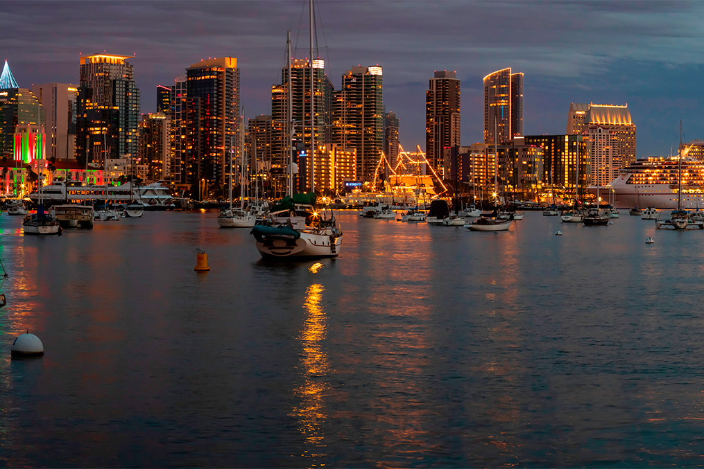 A brightly lit San Diego cityscape at night, highlighting festive winter activities for 2025-2026.