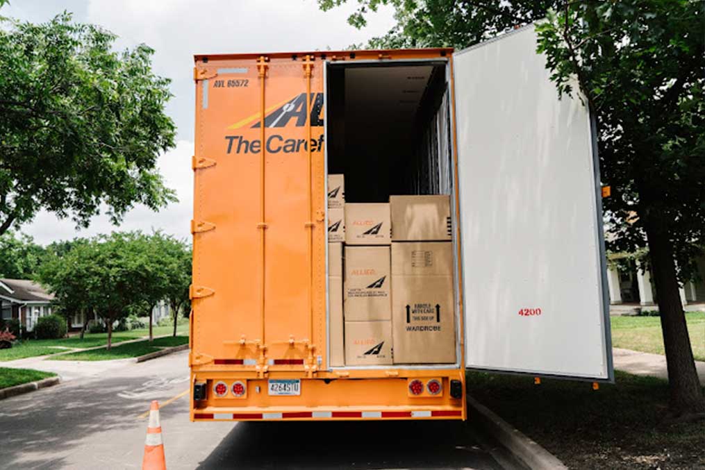 A truck filled with boxes is stopped on the side of the road, representing transportation in Solana Beach's coastal community.