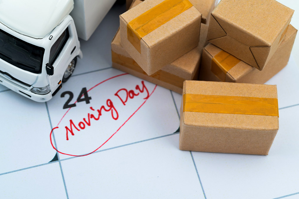 Visual representation of moving day, showcasing packed boxes and a relocation guide from California to China.