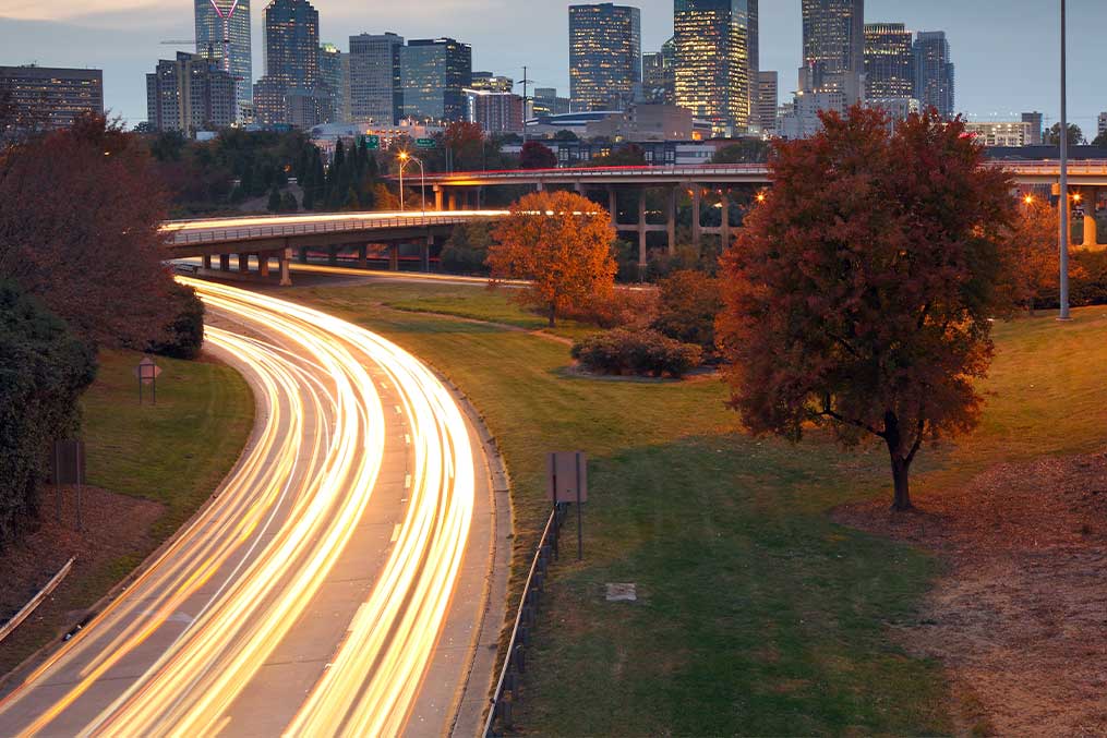 The skyline of a city in the distance, representing the transition from San Diego to Charlotte, NC