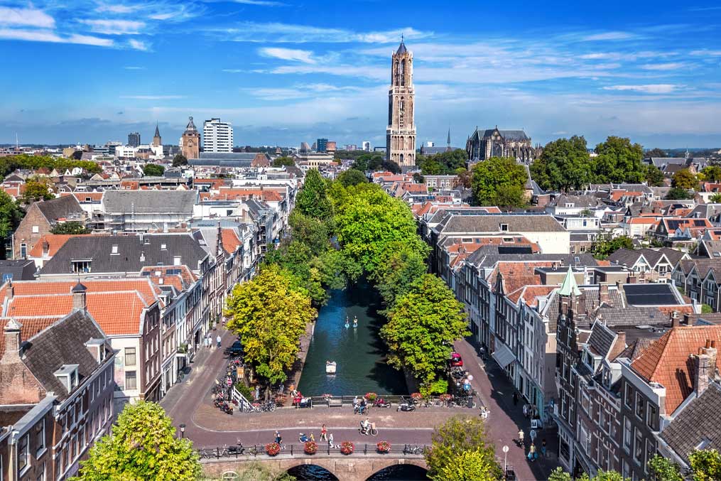 Utrecht town аerial drone view from above, typical Dutch city skyline, Utrecht cityscape with tower, canals and houses, Holland, the Netherlands