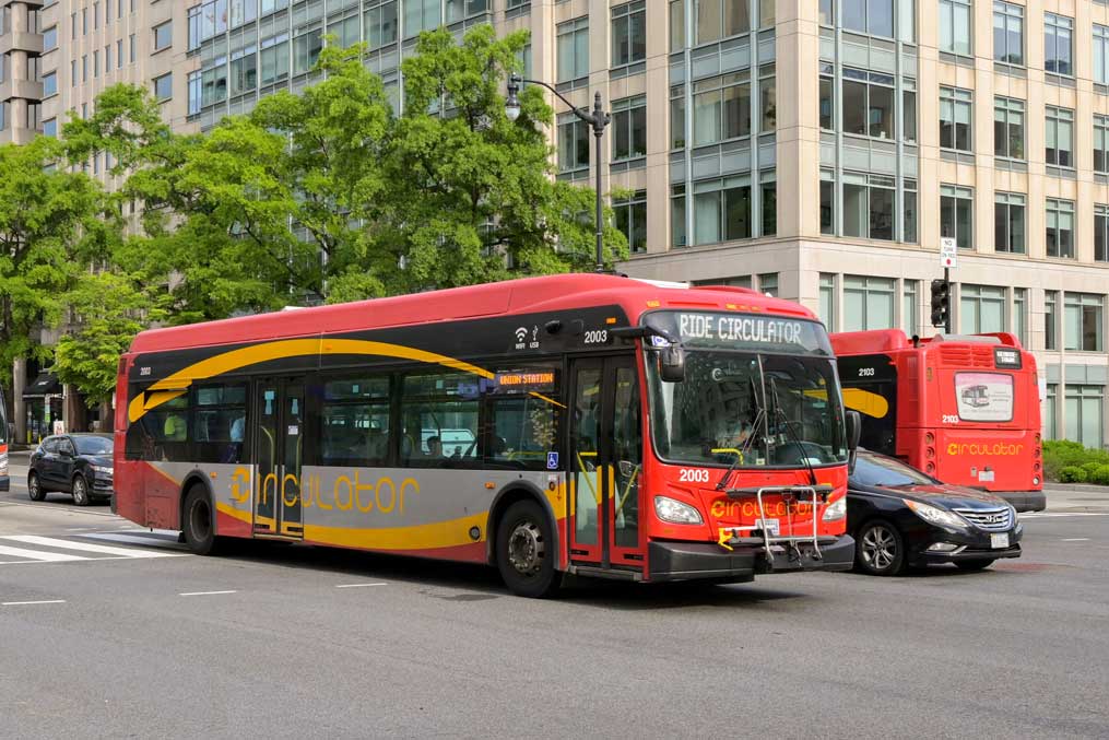 Washington DC, USA - 30 April 2024: Metrobus public service bus driving on a street in downtown Washington DC