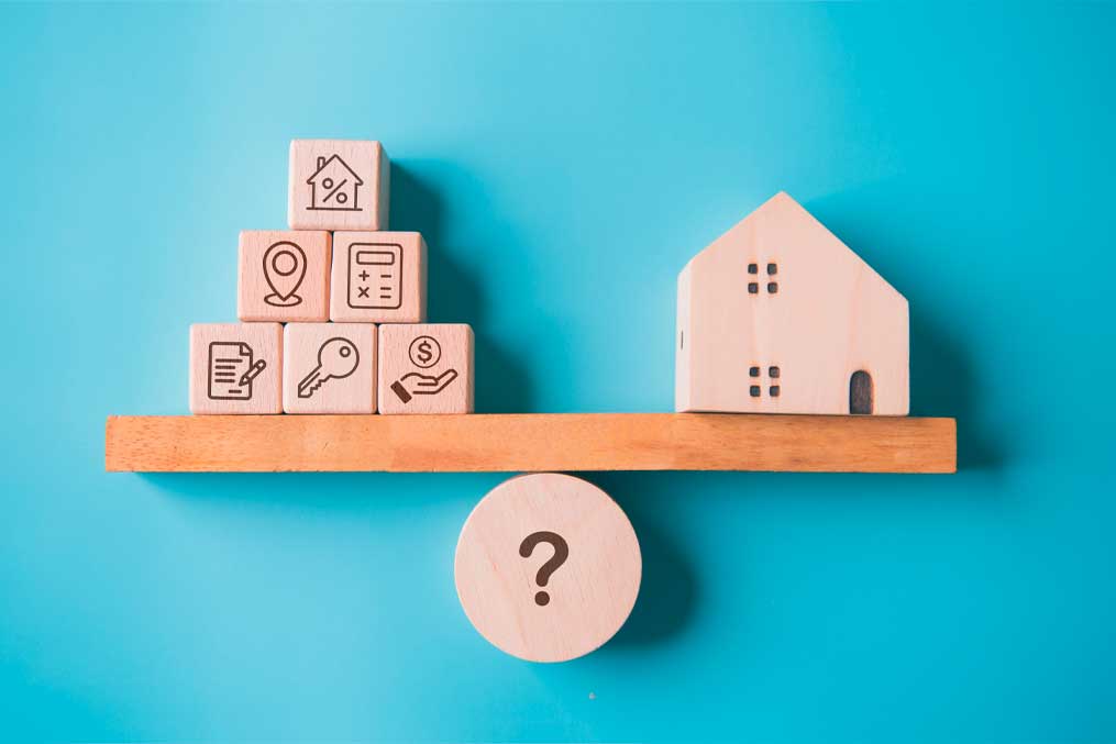 House buying factor with real estate home on weighting balance scale on blue background. Business mortgage loan investment and Property management team concept.