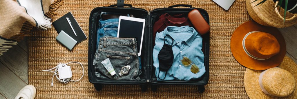Suit case open and full of things
